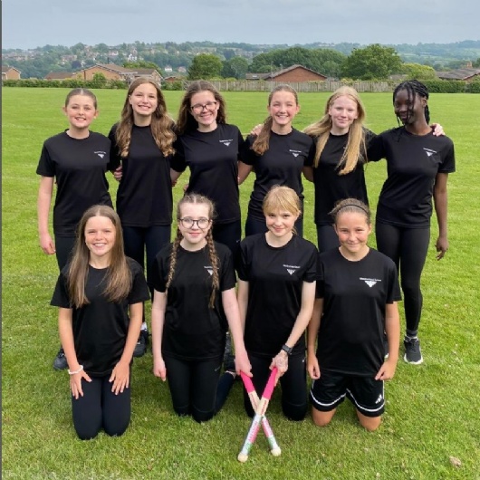 Y8 girls rounders team pose after their match